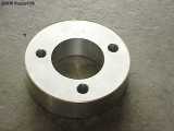 The machined aluminum ring with my holes drilled.