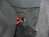 The inboard lap belt unfortunately required punching a hole through the carpeting and steel and installing a bolt that won't get in the way of the seat.
