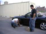 John and I are teaching Jason how to change his own brake pads.