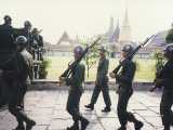 The Thai army protects the old Royal Palace. The three Budhist temples in Ceylon, Thai and Cambodian styles are in the background. Yes, they are covered in gold.