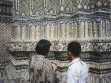 Our guide explains to us that the tiny pieces on this piece are actually from a set of porcelain dishes sent to the king that was damaged in transit. He then had the little pieces used to adorn some of the buildings around the palace.
