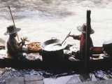 These women at the floating market prepare hot snacks. All you need is a boat, a wok and a propane tank.