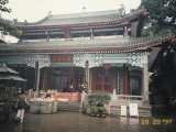Lily approaching the female Buddha, where Cantonese women go to pray for a child, specifically a son.