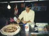 Another night market street vendor making Thai sausage. We don't recommend the Thai Sausage.