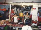 Typical street vendor in Hong Kong, this one selling <ITALIC>fresh</ITALIC> fish. Housewives often shop twice a day. Chinese almost never eat anything that's been frozen.