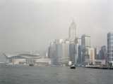 The hazy Hong Kong Island skyline taken from the Kowloon side of the bay.
