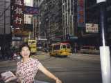 Lily poses in her famous 'That Girl' pose in a typical Hong Kong street.